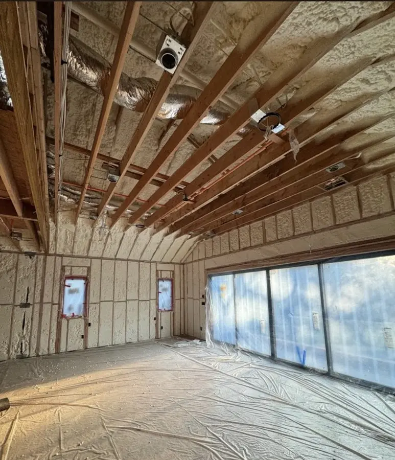 Interior walls and ceiling insulated with spray foam during new construction in Fremont